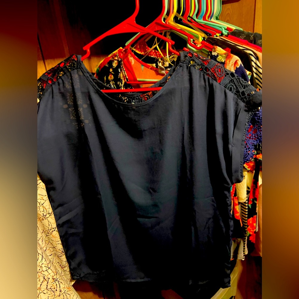 Navy blue blouse with lace on upper back never worn tighter around the chest
